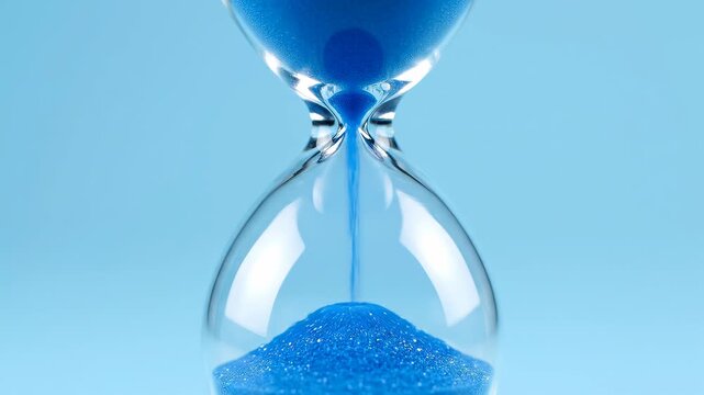 Blue sand timer close up. Workflow deadline, productivity focus and time tracking concept.