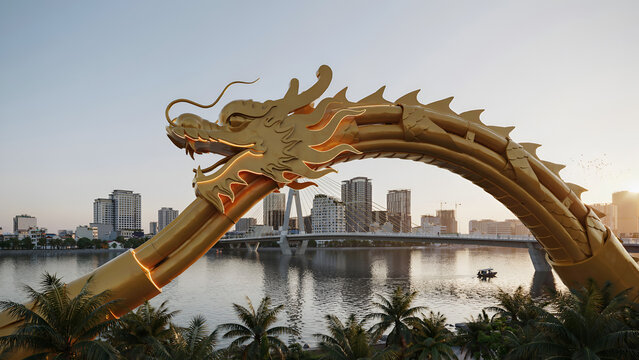 Golden Dragon Bridge arching over river during sunset with cityscape in background
