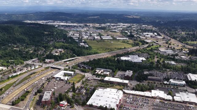 Aerial of suburban commercial corridor in Clackamas County Oregon with highway 205 and shopping centers in southeast Portland
