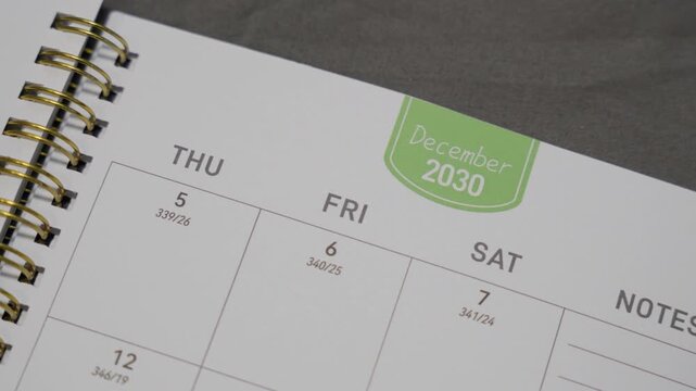 December 2030 planner page with slow right camera movement for annual scheduling and calendar planning concept