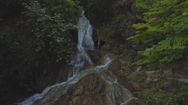 A beautiful natural waterfall flowing over rocky formations in the forest of El Salto, near Monterrey, Nuevo Le&oacute;n, Mexico. Surrounded by lush vegetation and rugged mountain scenery, this peaceful land