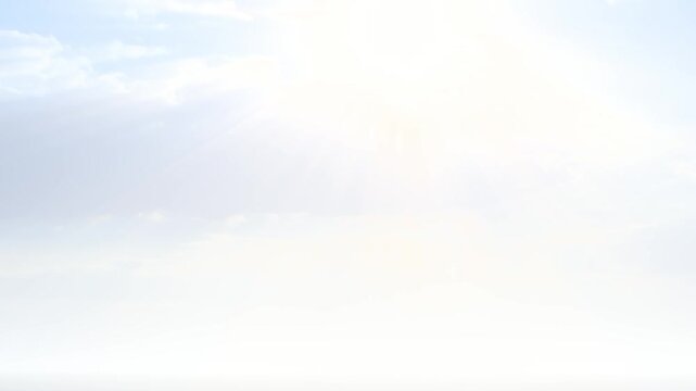 Heavenly Glowing White Sky with Bright Sun and Soft Clouds