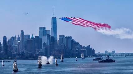 Fototapeta premium Celebrate July 4th and the 250th anniversary of the USA with iconic fireworks and aerial displays over the New York skyline featuring ships and a blimp in a vibrant festive atmosphere.