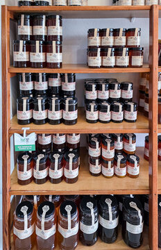 XALO, SPAIN - JUNE 20, 2026.Diverse selection of organic Spanish honey jars in Xalo with Casta&ntilde;o, Brezo, and Azahar flavors on wooden shelves