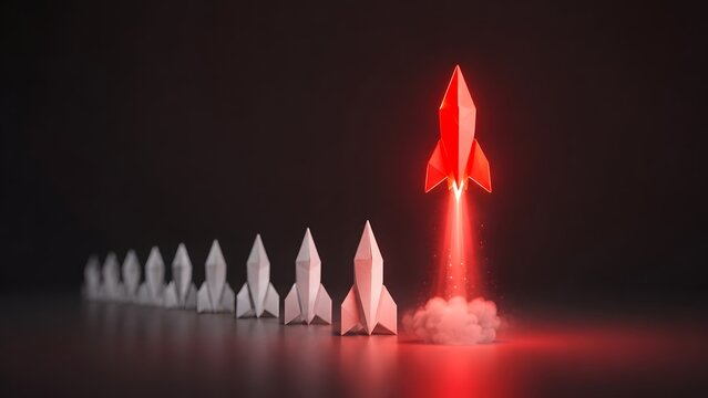 Red paper rocket launching from a row of white rockets concept of startup business innovation and competitive advantage