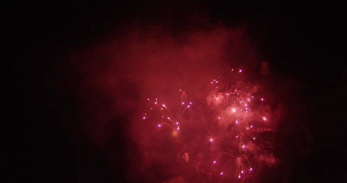 Massive, Colorful Fireworks Bursting In The Night Sky