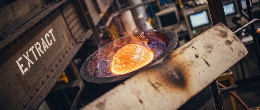 Molten metal extraction industrial foundry crucible glowing with heat in steel mill factory, heavy metallurgy manufacturing processing hot liquid iron ore and copper alloy. Production background.
