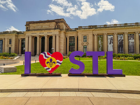 St. Louis, Missouri, USA - July 1, 2026: Large "I Heart STL" public art display with a red fleur-de-lis heart in front of the Missouri History Museum exterior on a sunny day in Forest Park.