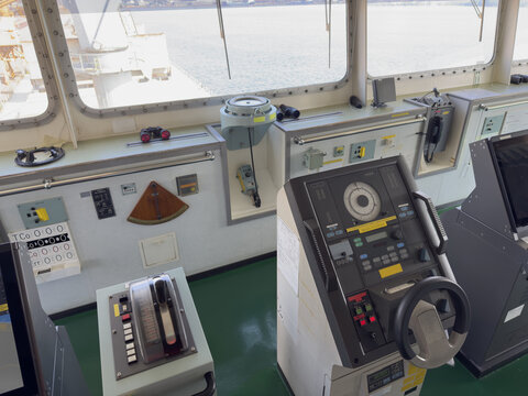 cargo ship navigation bridge steering gear and engine telegraph.