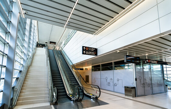Riyadh, Saudi Arabia - February 21, 2026: Modern interior of the Riyadh Exhibition Center Metro Station featuring escalators and signage.