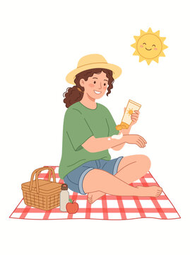 Woman applying sunscreen during a sunny picnic