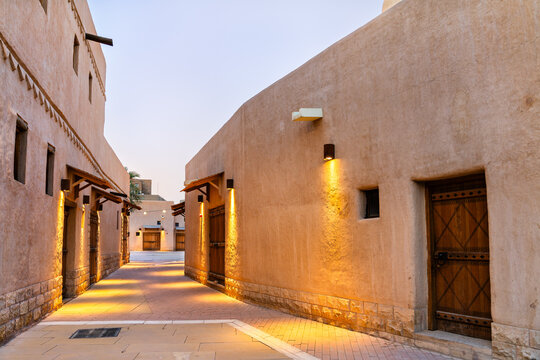 Historic mud brick alleyway with traditional architecture and lights in the old town of Ad Dirah, Riyadh, Saudi Arabia.