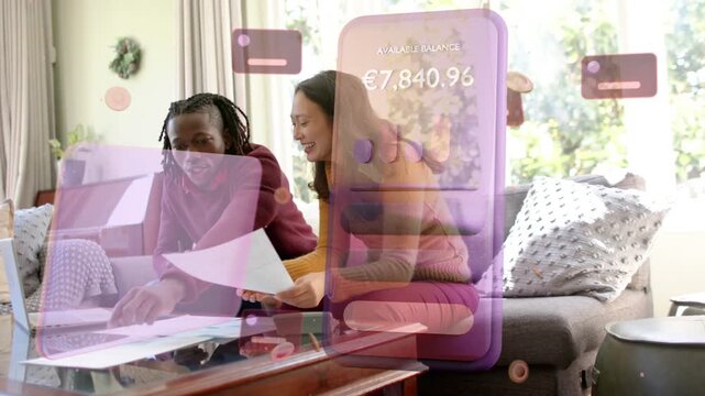 Couple tapping laptop and sorting bills, purple finance UI appearing over them and showing balance