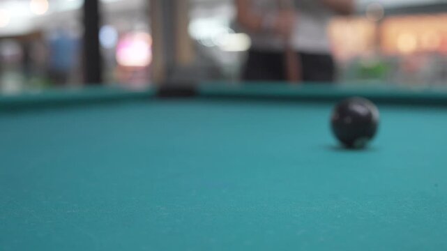 Winning shot sinking the black eight ball