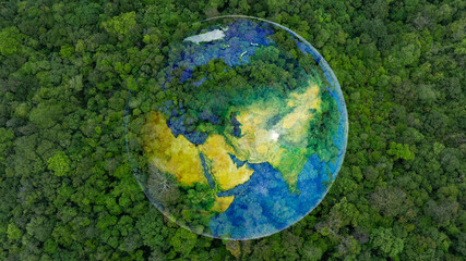 Obraz premium Atmospheric aerial view of the green forest with the earth Demonstrate the concept of preserving the top ecosystem and natural environment and Save Earth. 