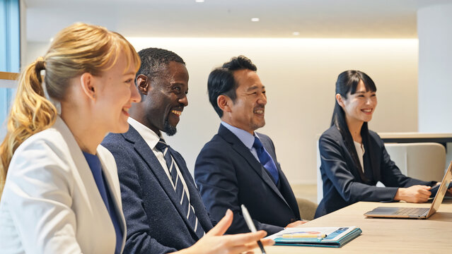 A group of multinational businesspeople having a meeting in a conference room.