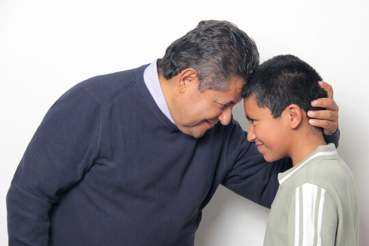Latino single dad and his 12-year-old Latino son show their love to celebrate Father's Day