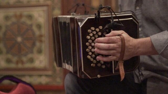 Musician Playing Bandoneon in Intimate Tango Performance