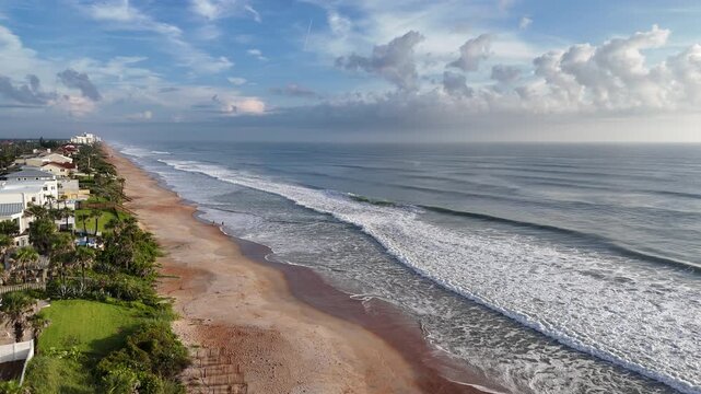 Beautiful morning with waves breaking along Ormond Beach in Volusia County, Florida