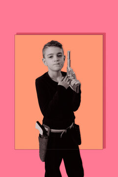 Gunslinger. Playful portrait of a young boy dressed as a cowboy, posing confidently in a themed costume with toy guns. Fun, humorous children&rsquo;s character for editorial, advertising, graphic resources