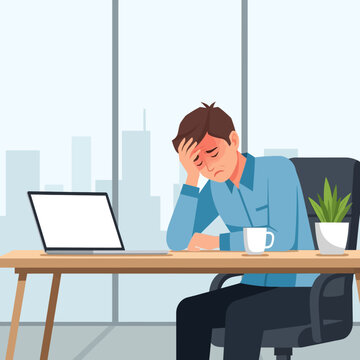 Stressed Businessman Feeling Overwhelmed At His Desk With Laptop And Coffee Cup