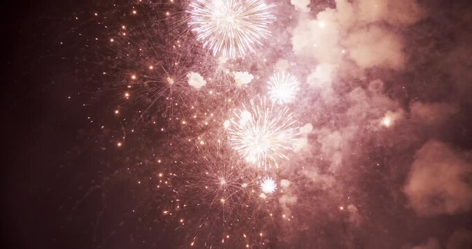 White and Pink Firework Burst with Trailing Sparks And Smoke In Provo Utah