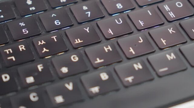Horizontal Macro Pan Right to Left Over Korean Laptop Keyboard