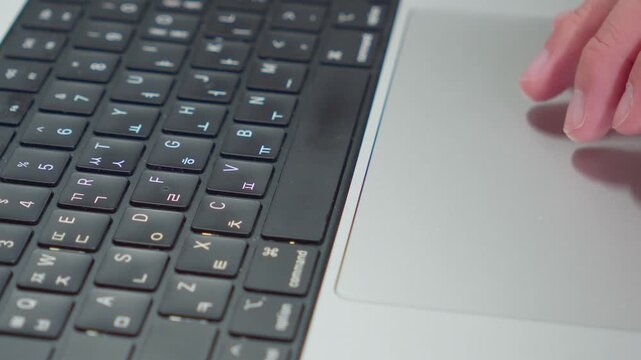 Using Laptop Trackpad and Typing Close Up