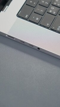 Plugging Type-C Cable Into Laptop Port Close Up Vertical 4K