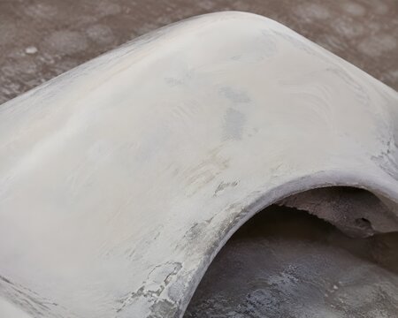 Fiberglass Body Panel Covered In Thick Layer Of White Bondo Filler Partially Sanded Perfectly Smooth