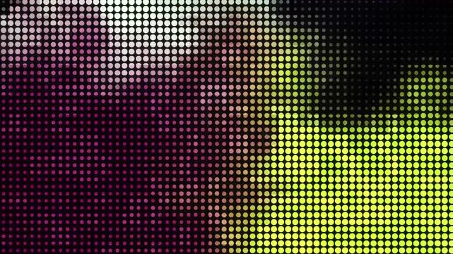 Abstract glowing LED screen dot pattern in neon magenta and yellow