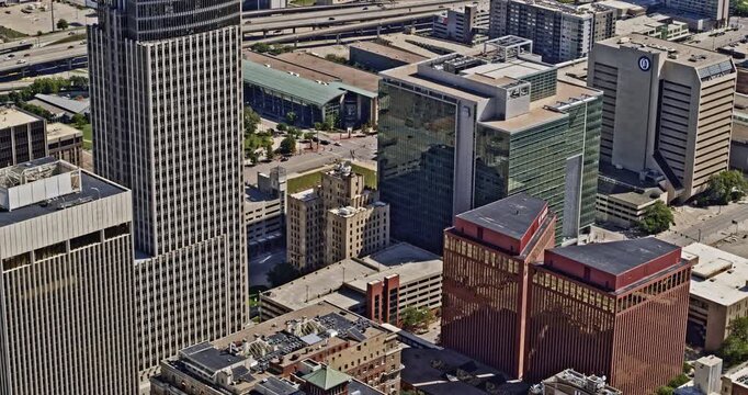 Omaha Nebraska Aerial v19 drone tilting upward from downtown skyscrapers toward distance baseball stadium and eppley airfield - Shot with Inspire 2, X7 camera - August 2020