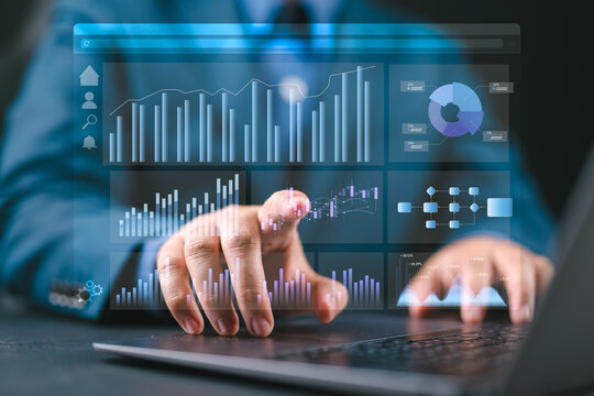 Web analytics dashboard. Marketing data visualization. Statistical graphs and reports. Businessman analyzing website traffic using a laptop computer.