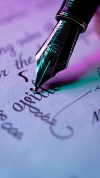 Fountain pen writing elegant cursive script on paper with dramatic lighting, writing, journaling, calligraphy