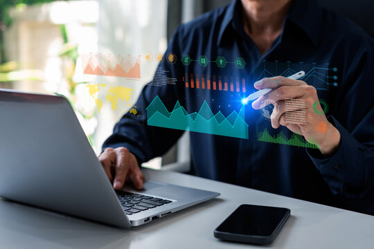 Businessman with a modern visual screen global network connection Graph analyzing financial growth and investment data planning concept