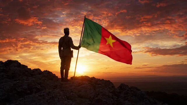 Soldier holding cameroon flag on mountain peak at sunset, patriotic concept, national pride, independence day celebration, military honor and loyalty