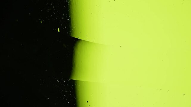 Abstract liquid separation with lime green and black contrast