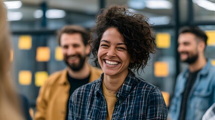 Obraz premium Collaborative Laughter: Diverse Startup Team in Bright Modern Workspace