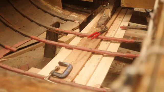 Traditional clinker lapstrake wood boat with replaced planks
