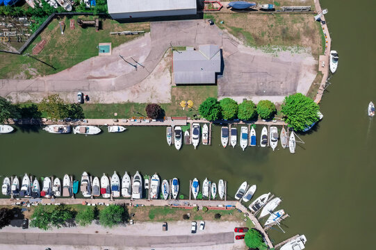 Aerial view marina with many boats docked on water