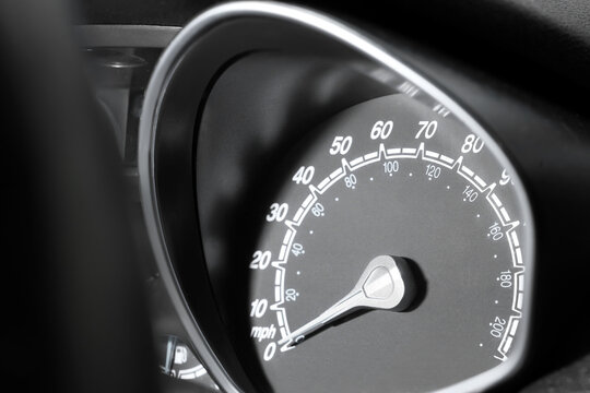 Close-up of car speedometer showing zero mph