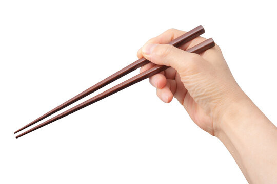 箸を持っている手。箸の持ち方