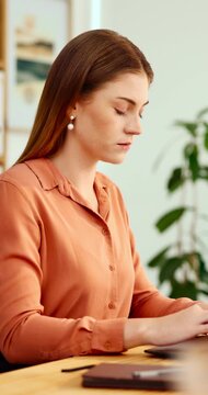 Typing, online and woman with laptop in office, serious and planning for case with digital evidence. Corporate, legal assistant and person with technology, information and trial research in law firm