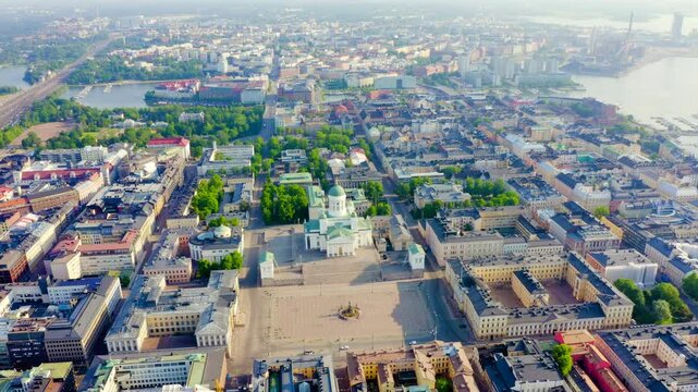 Helsinki, Finland. Helsinki Cathedral with its green copper dome and symmetrical neoclassical facade, Drone footage over Senate Square and the historic city center on a bright summer morning. Drone f