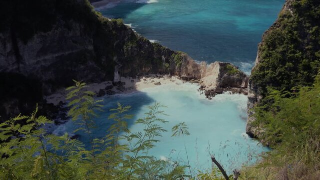 Diamond Beach (Pantai Diamond)  in Nusa Penida, Bali, Indonesia. Shot from near Thousand Islands Viewpoint looking down on the white shores, dramatic limestone cliffs and crystal clear water. 