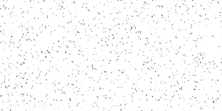A field of countless tiny grey specks scattered randomly across a stark white background creates an abstract pattern of light and shadow, suggesting a subtle texture or a distant, blurred landscape.
