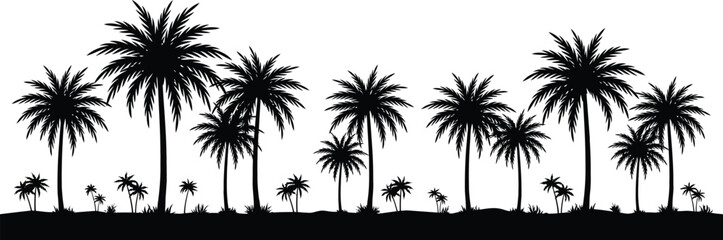 Fototapeta premium Tropical palm trees silhouetted against a cloudy sky at sunset silhouettes