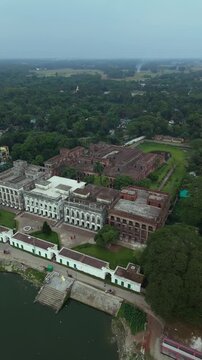 Aerial drone view of a grand historical palace complex with intricate architecture and