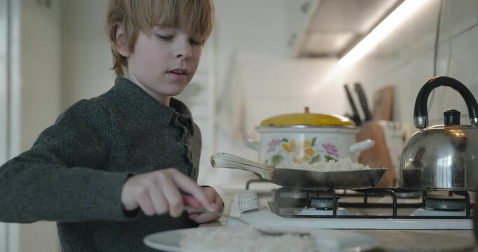 Kid Boy Eat Rice and Sausage. Eating Breakfast Lunch in Kitchen. 4K 10-bit