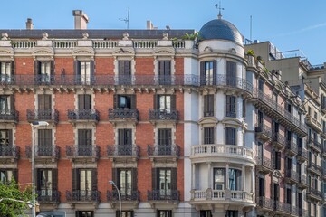Fototapeta premium Classic Residential Building Facade In Barcelona, Historic Apartment Exterior, Corner Tower Architecture